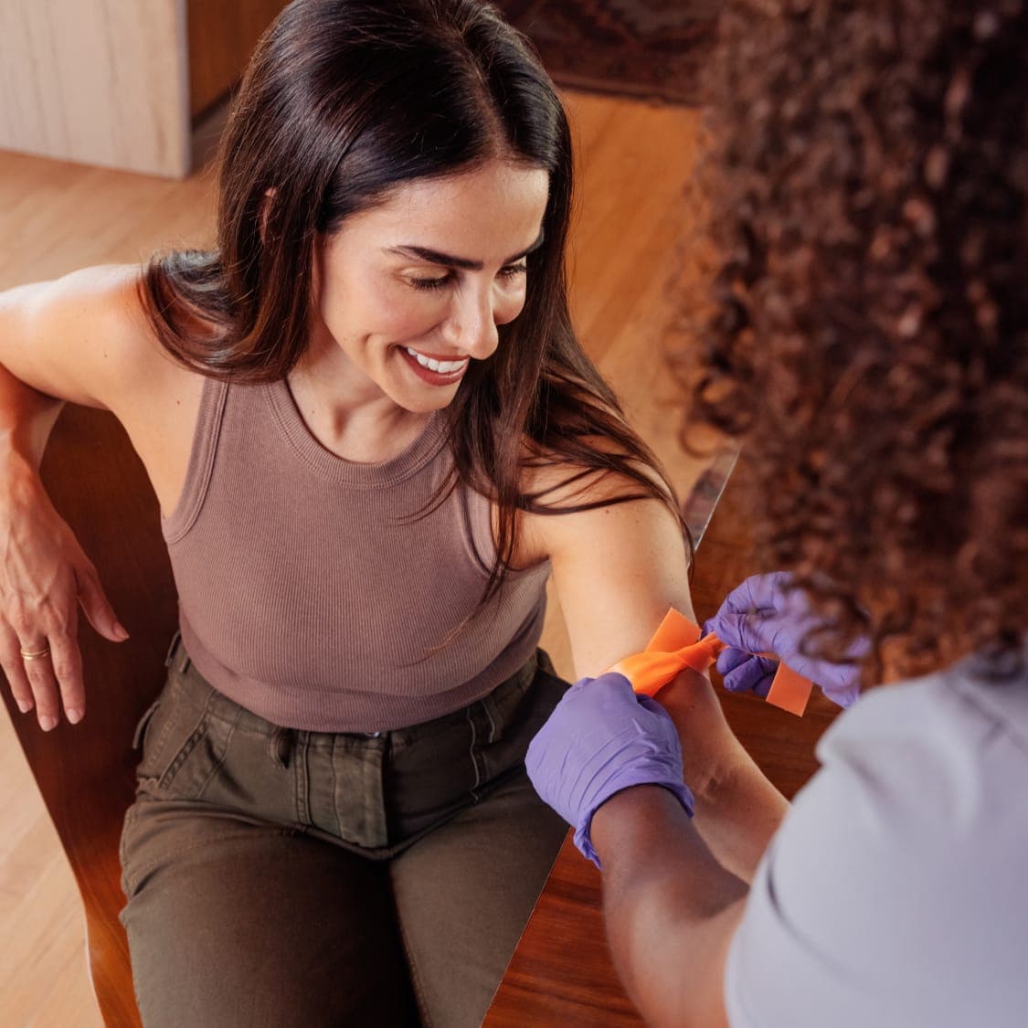 pause membership woman getting blood drawn