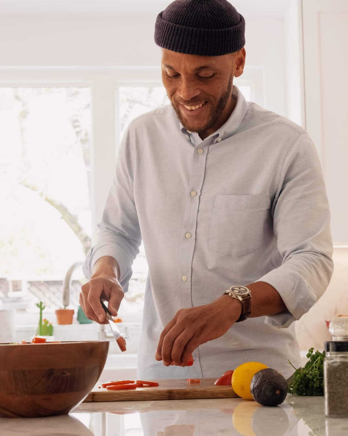 guy cutting fruits