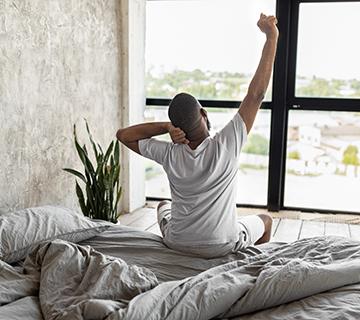 man getting out of bed