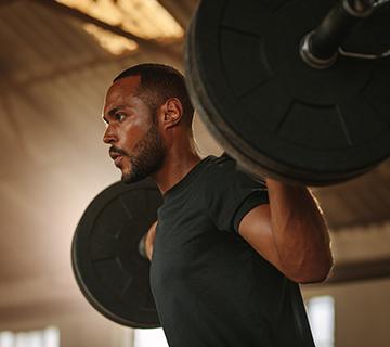 man lifting weights