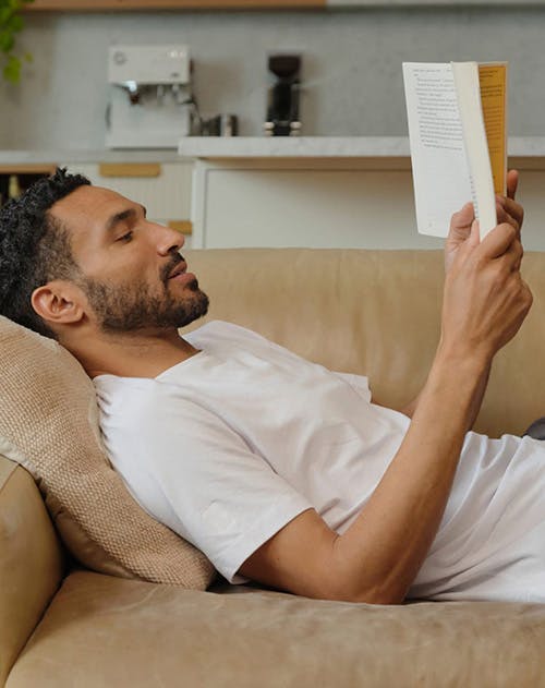 guy reading book